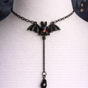 Black bat choker with red jewel and black metal hardware